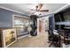 Functional bedroom with a window, ceiling fan, and closet providing ample storage and natural light for work or rest at 5437 Se 34Th St, Ocala, FL 34480