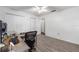 Office-style bedroom with laminate floors, a window with natural light, and a large closet at 5437 Se 34Th St, Ocala, FL 34480