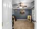 Cozy carpeted bedroom with a ceiling fan, window, and playful decor, ready for personalization at 5437 Se 34Th St, Ocala, FL 34480