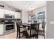 Cozy dining area with tile flooring, a chandelier, and a view of the backyard through a large window at 5437 Se 34Th St, Ocala, FL 34480
