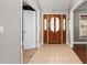 Entryway featuring decorative leaded glass door and tile flooring at 5437 Se 34Th St, Ocala, FL 34480