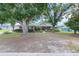 Inviting home with mature trees, lush lawn, and classic design elements enhancing curb appeal at 5437 Se 34Th St, Ocala, FL 34480