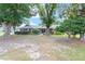 Charming single-story home with mature trees, a well-manicured lawn, and inviting curb appeal at 5437 Se 34Th St, Ocala, FL 34480
