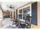 Cozy front porch with rocking chairs and ceiling fans, ideal for relaxing outdoors at 5437 Se 34Th St, Ocala, FL 34480