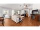 Living room featuring hardwood floors, built-in bar, and ample seating with lots of natural light at 5437 Se 34Th St, Ocala, FL 34480