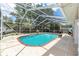 Relaxing screened-in pool with brick trim and sunny backyard views, perfect for outdoor enjoyment at 5437 Se 34Th St, Ocala, FL 34480