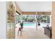 Relaxing screened-in patio leading to a pool, perfect for outdoor living at 5437 Se 34Th St, Ocala, FL 34480