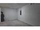 Unfinished basement featuring concrete floor and walls and a utility closet at 5635 Nw 2Nd St, Ocala, FL 34482