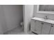 Bathroom with a white double vanity, marble-look tile floor, and modern fixtures at 5635 Nw 2Nd St, Ocala, FL 34482