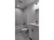Bathroom features marble tile, a shower-tub combo and updated vanity at 5635 Nw 2Nd St, Ocala, FL 34482
