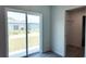 Bedroom with sliding glass door access to backyard and walk-in closet at 5635 Nw 2Nd St, Ocala, FL 34482