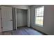 Bedroom featuring a window for natural light and closet for storage at 5635 Nw 2Nd St, Ocala, FL 34482