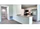 Bright kitchen featuring stainless steel appliances, granite countertops, and a breakfast bar at 5635 Nw 2Nd St, Ocala, FL 34482