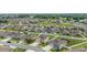 Neighborhood aerial view with well-manicured lawns and homes, some with pools at 5653 Sw 50Th Ter, Ocala, FL 34474