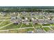 Aerial shot highlighting residences in a community with mature landscaping and green lawns at 5653 Sw 50Th Ter, Ocala, FL 34474