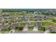 Expansive aerial view of neighborhood featuring green lawns and various home styles at 5653 Sw 50Th Ter, Ocala, FL 34474