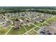An aerial perspective of homes with green lawns in a suburban neighborhood setting at 5653 Sw 50Th Ter, Ocala, FL 34474