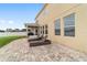 Backyard featuring a paver patio and covered porch at 5653 Sw 50Th Ter, Ocala, FL 34474