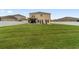 Expansive backyard with lush green grass, perfect for outdoor activities at 5653 Sw 50Th Ter, Ocala, FL 34474