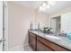 Bathroom showcasing a double sink with granite countertops and stylish fixtures at 5653 Sw 50Th Ter, Ocala, FL 34474