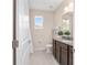 Well-lit bathroom with granite countertops, and neutral paint at 5653 Sw 50Th Ter, Ocala, FL 34474