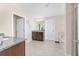 Bright bathroom with double vanity, granite countertops, tile floors, shower, and tub at 5653 Sw 50Th Ter, Ocala, FL 34474