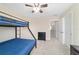 Bedroom with a bunk bed, plush carpeting, and plenty of space at 5653 Sw 50Th Ter, Ocala, FL 34474