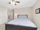 Spacious bedroom featuring carpeted floors, a ceiling fan, and easy access to other rooms at 5653 Sw 50Th Ter, Ocala, FL 34474