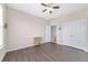 Comfortable bedroom featuring two windows, neutral paint, and laminate flooring at 5653 Sw 50Th Ter, Ocala, FL 34474