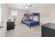 Bedroom with a bunk bed, desk, and carpeting, perfect for a room at 5653 Sw 50Th Ter, Ocala, FL 34474