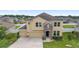 Charming two-story home with a three-car garage and manicured front lawn at 5653 Sw 50Th Ter, Ocala, FL 34474