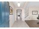 Bright foyer with tile flooring, staircase, and an arched entryway into the living spaces at 5653 Sw 50Th Ter, Ocala, FL 34474