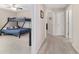 Hallway view showcases a carpeted floor, neutral walls and an adjacent bedroom with a bunk bed at 5653 Sw 50Th Ter, Ocala, FL 34474