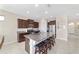 Modern kitchen with granite counters, a large island and stainless steel appliances at 5653 Sw 50Th Ter, Ocala, FL 34474