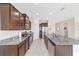Spacious kitchen featuring stainless steel appliances, granite countertops, and a large island with seating at 5653 Sw 50Th Ter, Ocala, FL 34474