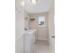 Bright laundry room with a full-size washer and dryer, and tiled floor at 5653 Sw 50Th Ter, Ocala, FL 34474