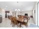 Open-concept living and dining area with abundant natural light and tile flooring throughout at 5653 Sw 50Th Ter, Ocala, FL 34474