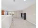 Spacious loft area with neutral carpeting, natural light and cabinet and bookcase for storage at 5653 Sw 50Th Ter, Ocala, FL 34474