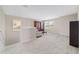 Loft area featuring carpet, two windows for natural light and sitting area with cabinets at 5653 Sw 50Th Ter, Ocala, FL 34474