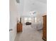 Spacious main bedroom with neutral walls, carpet, tray ceiling, and several windows at 5653 Sw 50Th Ter, Ocala, FL 34474