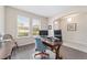 Office space with wood-look flooring, two windows overlooking the front yard, and work station at 5653 Sw 50Th Ter, Ocala, FL 34474