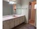Well-lit bathroom with a large vanity, ample counter space, and a shower at 616 Water Rd, Ocala, FL 34472