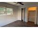 Light-filled bedroom with laminate flooring, a ceiling fan, and ample closet space at 616 Water Rd, Ocala, FL 34472