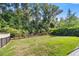 Spacious backyard with a lush lawn and privacy fence at 6557 Se 4Th Ln, Ocala, FL 34472