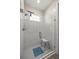 Modern bathroom features a walk-in shower, sleek tile, and a convenient shower seat at 6557 Se 4Th Ln, Ocala, FL 34472