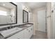 Bathroom features double sinks, plank wall and tile floors at 6557 Se 4Th Ln, Ocala, FL 34472