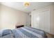 Cozy bedroom featuring a comfortable bed with bright comforter, closet, and natural light at 6557 Se 4Th Ln, Ocala, FL 34472