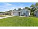Charming single-story home with a well-manicured lawn and attached garage at 6557 Se 4Th Ln, Ocala, FL 34472