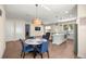 Open-concept floor plan showcases a dining area, kitchen island, and living space with modern finishes at 6557 Se 4Th Ln, Ocala, FL 34472