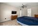 Main bedroom featuring a ceiling fan, a dresser and a TV at 6557 Se 4Th Ln, Ocala, FL 34472